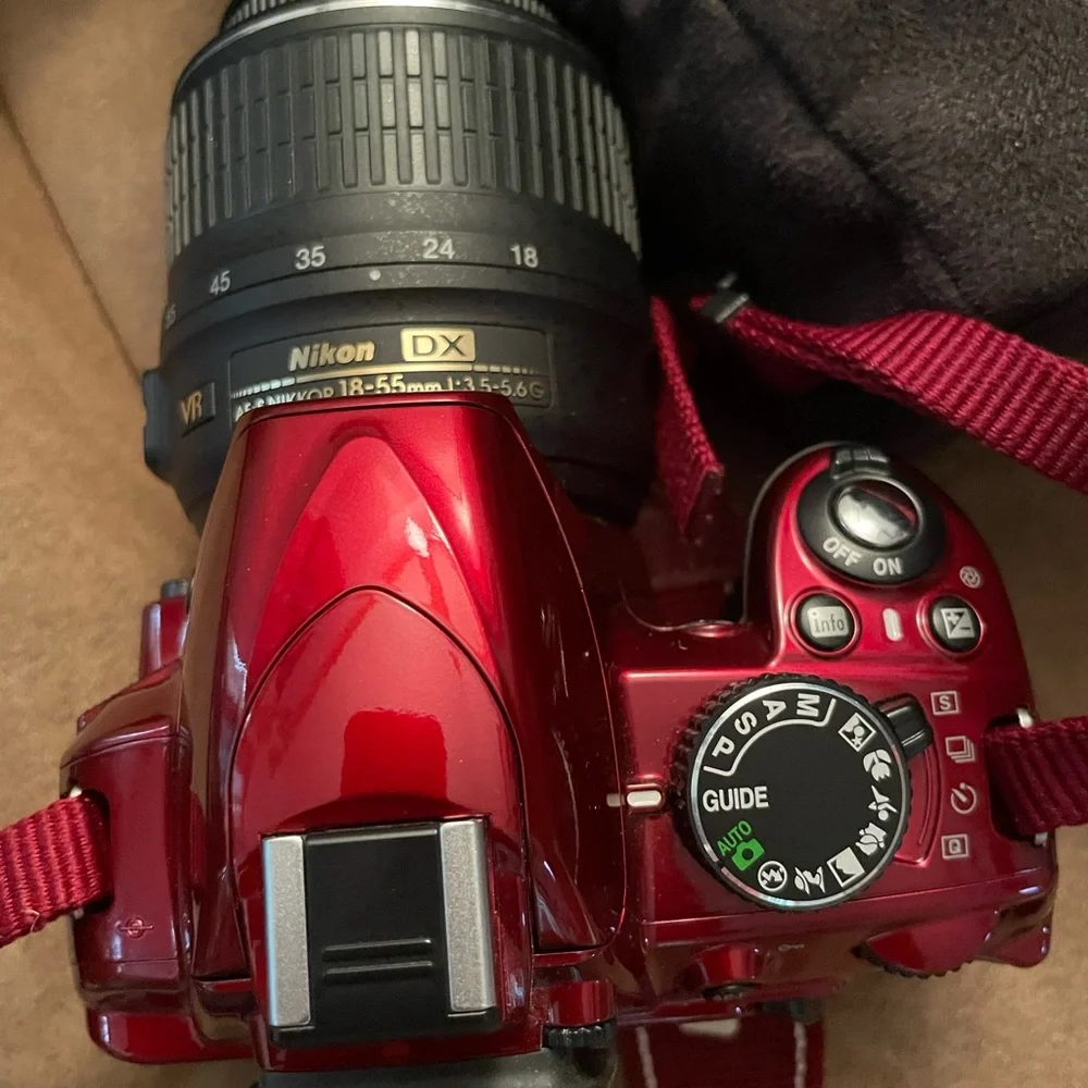 Nikon D3100 new camera has 2 batteries charger extra lens and carrying case